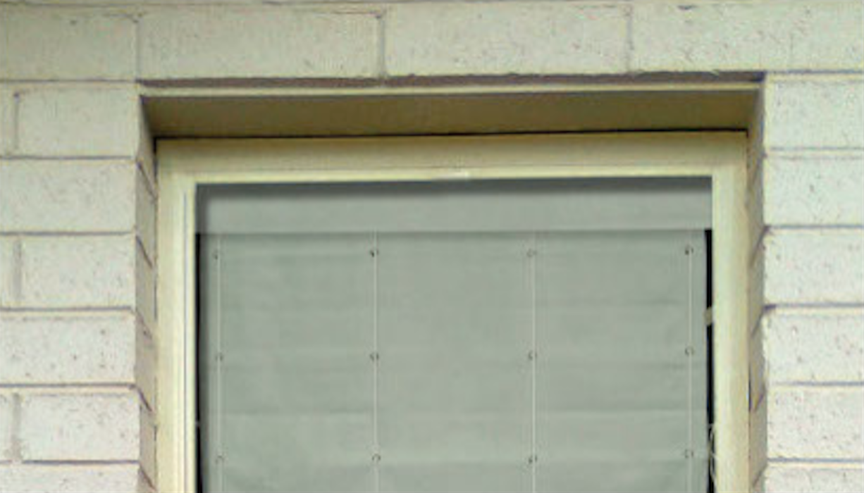 Fabric Roman Shades Covering a Kitchen Window